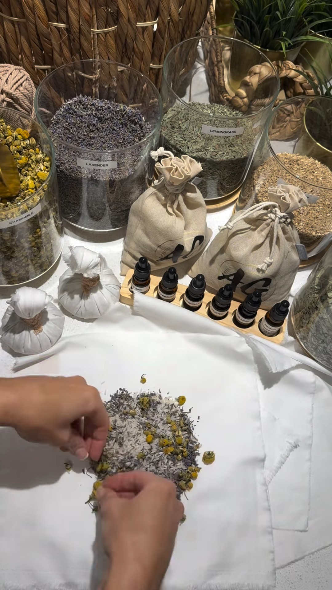 AG Herb Warm Compress ritual, herbs and oils laid out at AG Spa