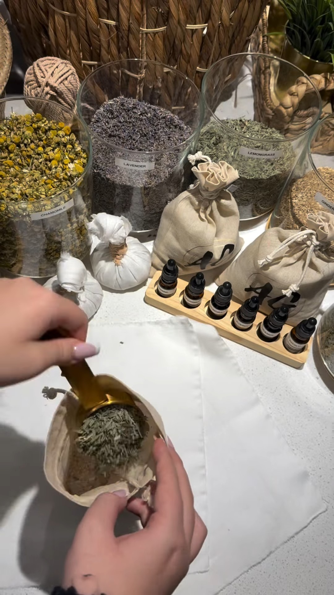 Scooping lavender for an herbal compress at AG Spa